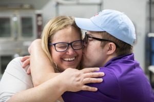 Man and woman hugging and laughing